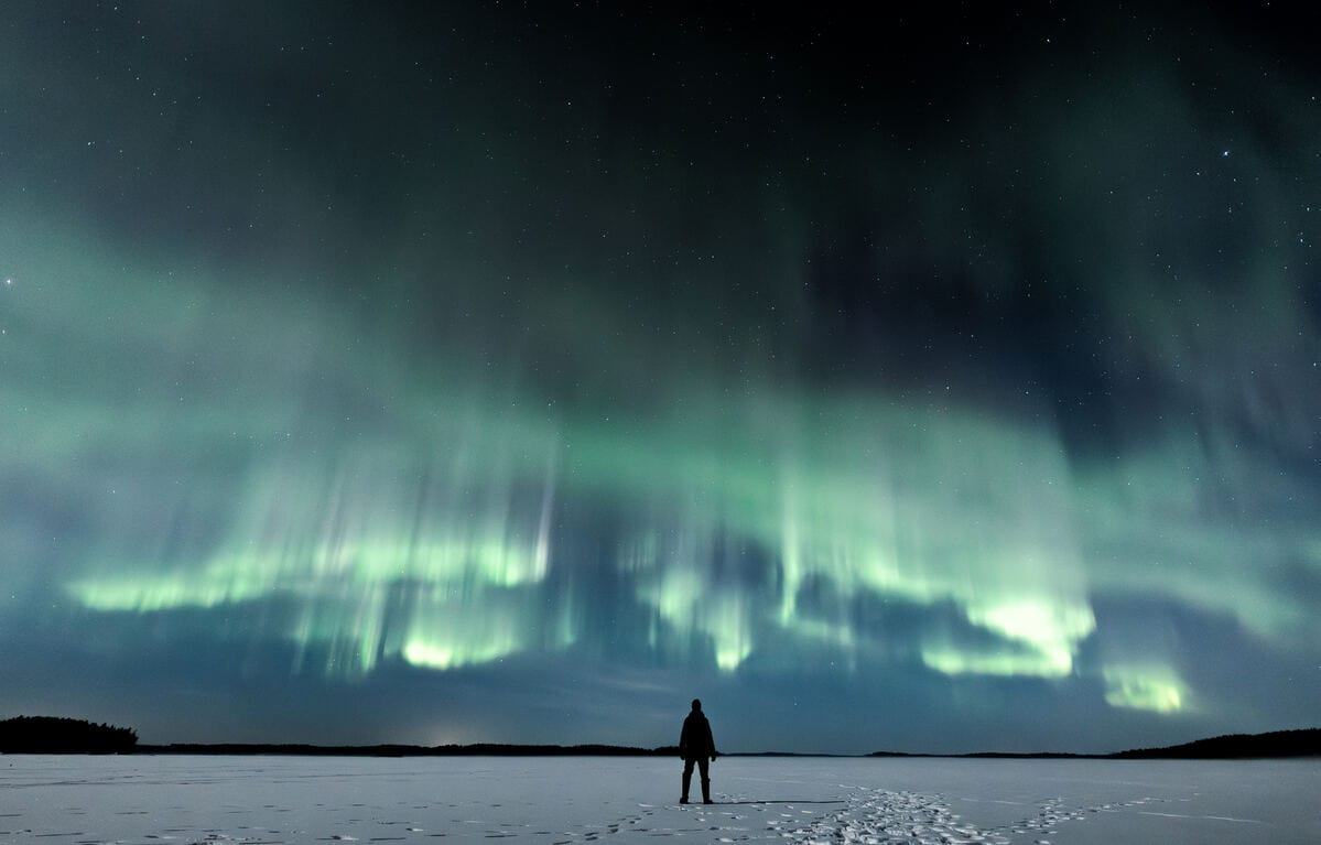 Aurora borealis over a frozen lake