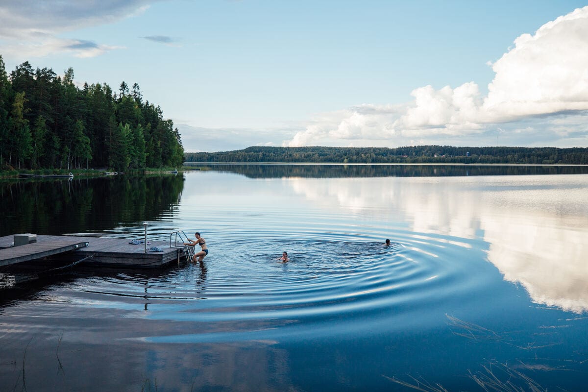 Swimmers in a calm Finnish lake